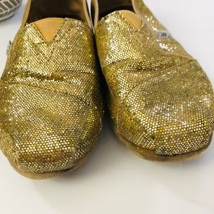 Gold TOMS Slip On Shoes